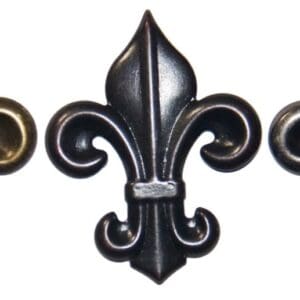 Three ornate fleur-de-lis in different finishes.