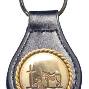 Here's an alt tag for the image: Leather keychain; praying cowboy, horse, cross.