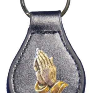 Black leather keychain with praying hands.