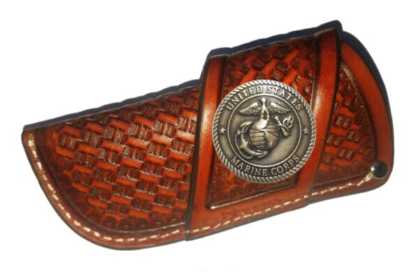 Leather knife sheath with Marine Corps seal.